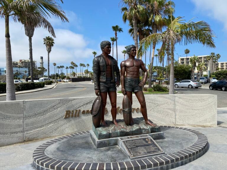 a statue of two men in swimsuits Seaside Lagoon in Redondo Beach